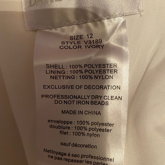NWOT DAVID’S BRIDAL WEDDING DRESS, Ivory in color says size 12. - Picture 9 of 16